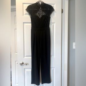 EXPRESS. Black lace jumper body suit. Chic. Classy. Comfortable. Size S.